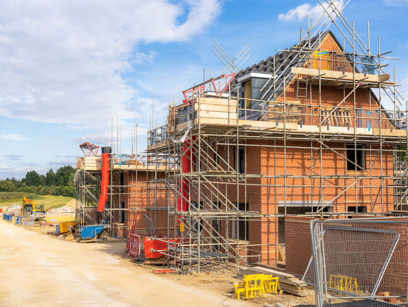 House with scaffolding being built