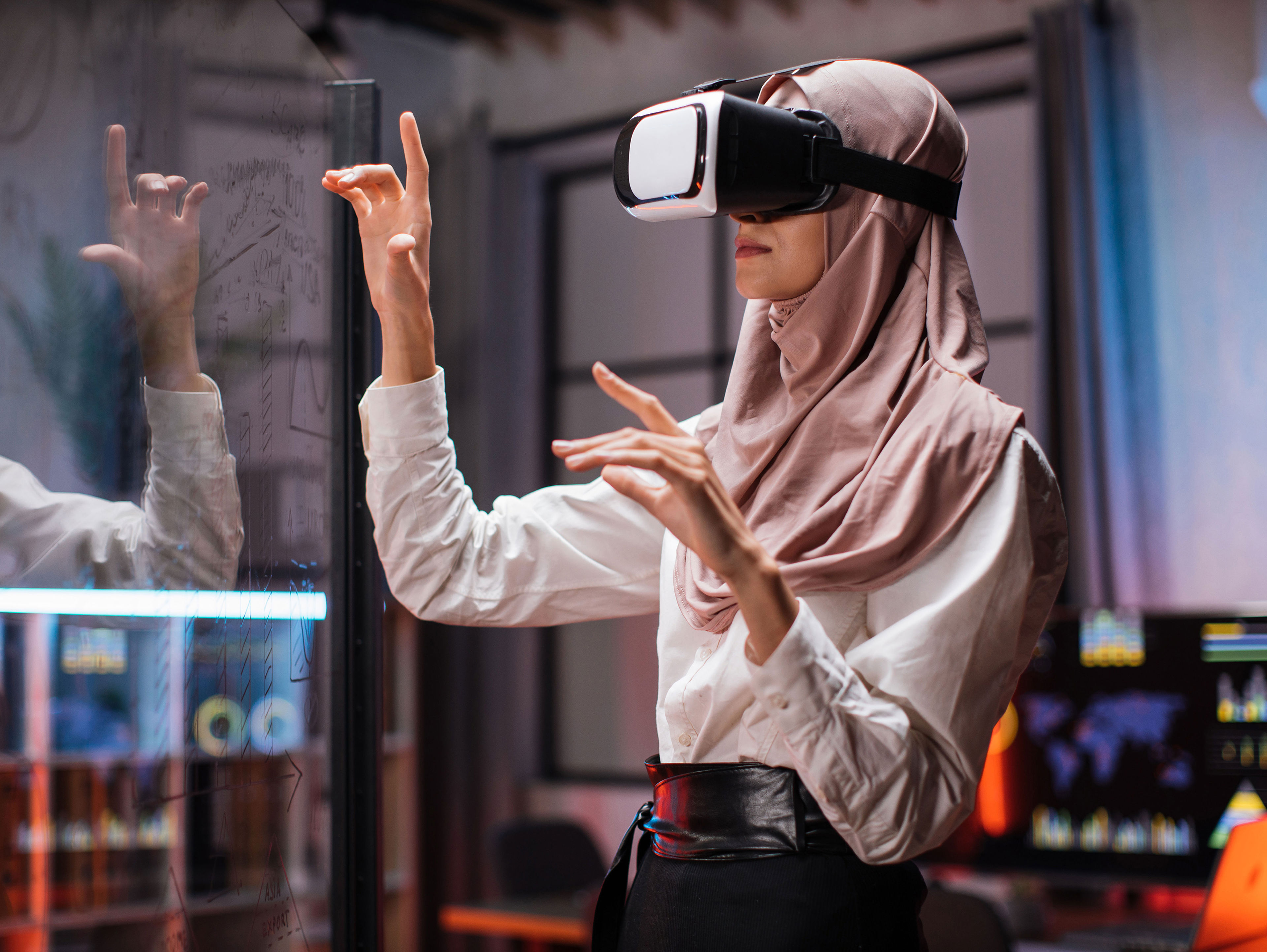 Woman In VR Glasses Standing At Office Room And Gesturing With Hands