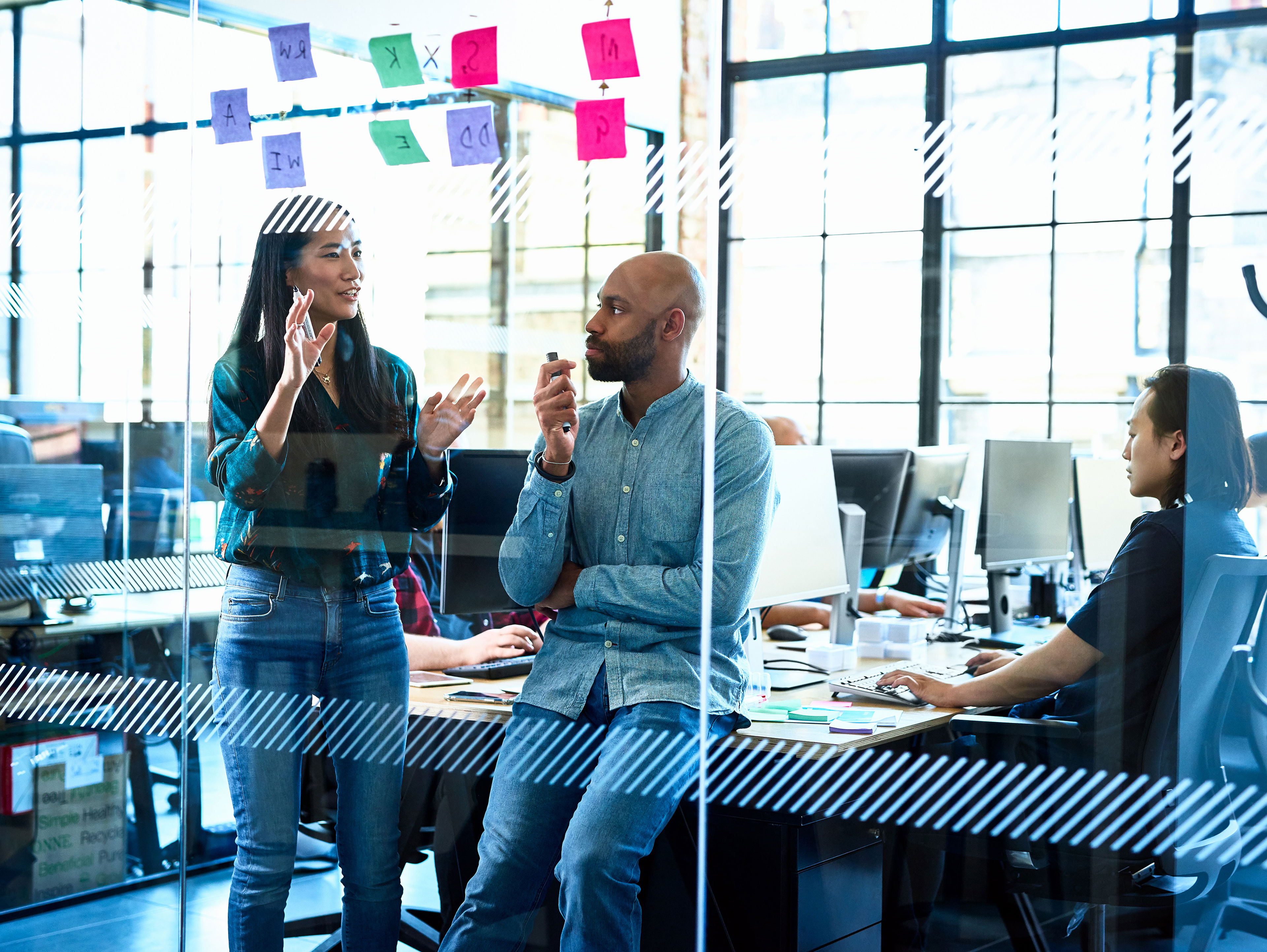 Woman Talking To Colleague In Office