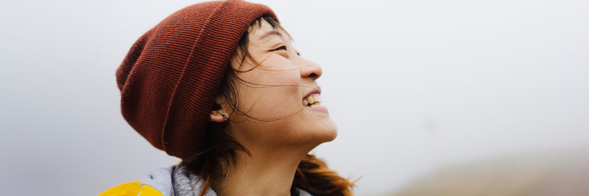 Woman In Nature On A Cold Foggy Day