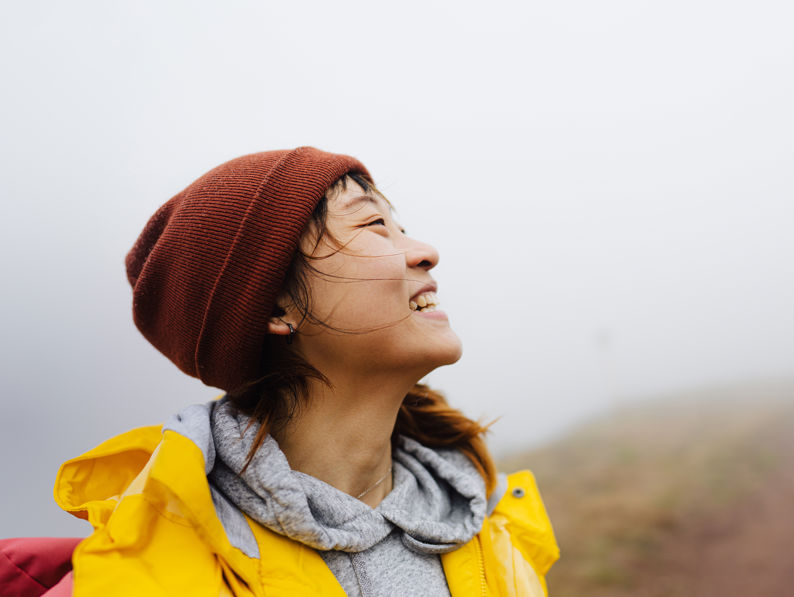 Woman In Nature On A Cold Foggy Day