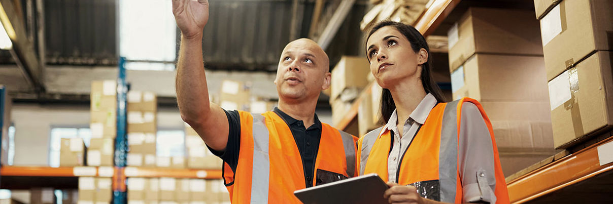 Warehouse staff in high visibility jackets