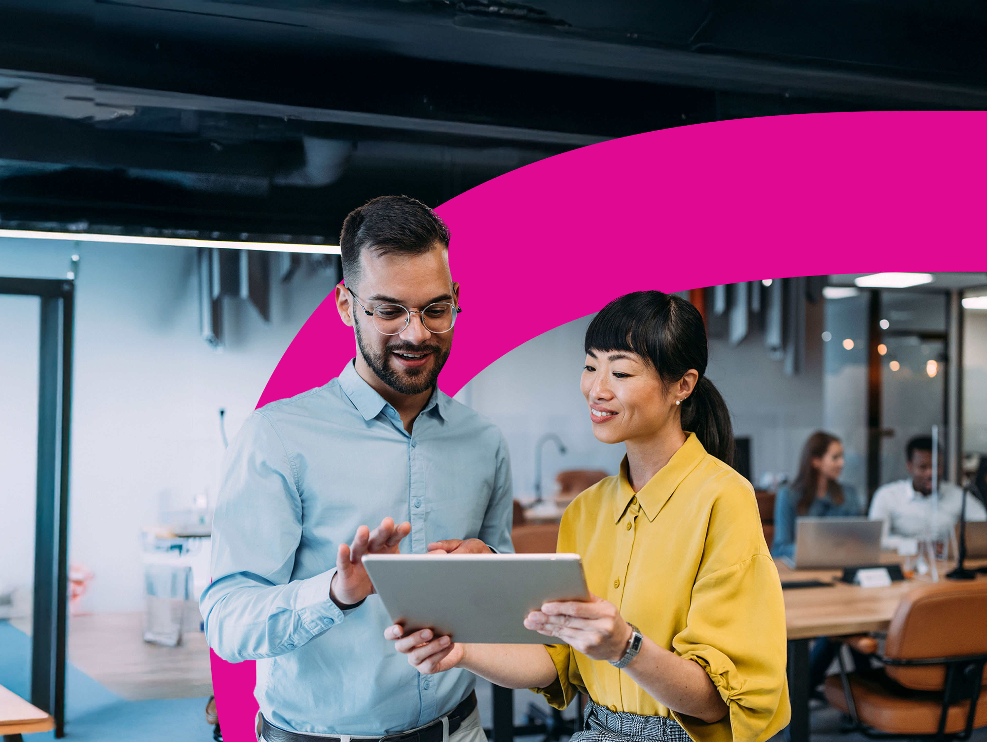 A person rides a bicycle along a paved path through a lush, green park with tall trees and grass on a sunny day.