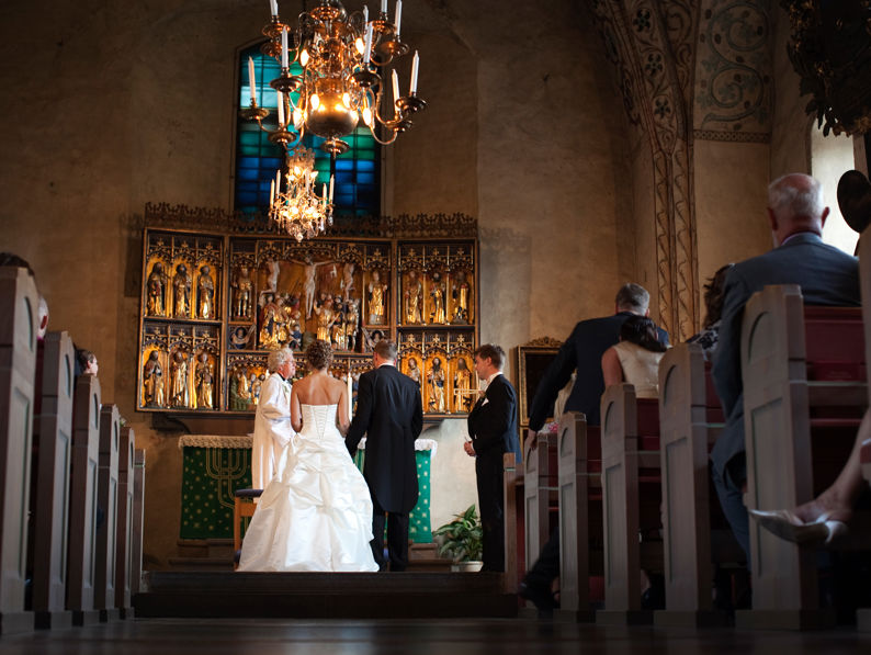 Bride And Groom Standing At The Alter
