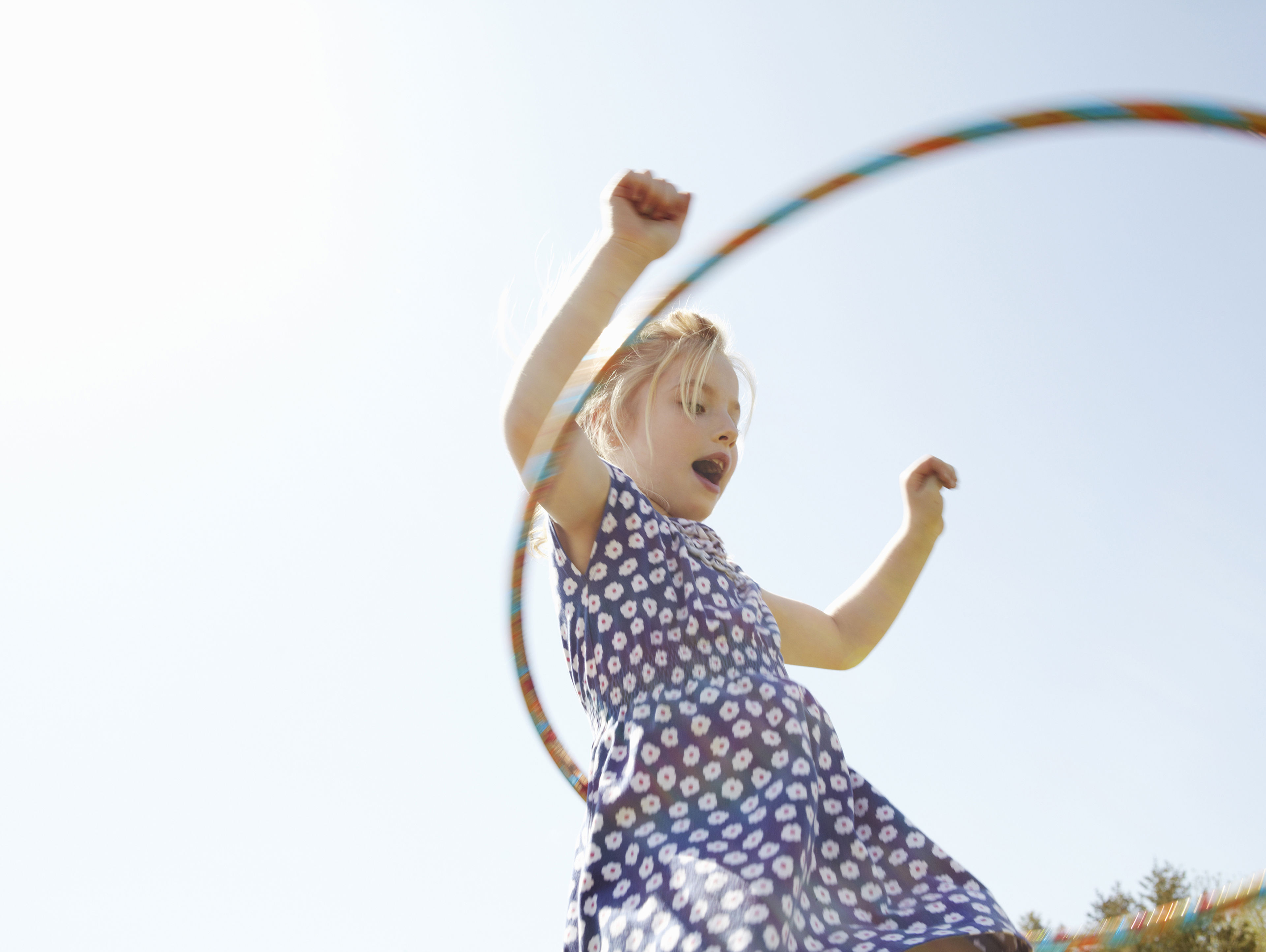 Girl Playing With Plastic Hoop