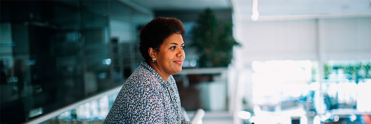 Businesswoman At Car Dealership