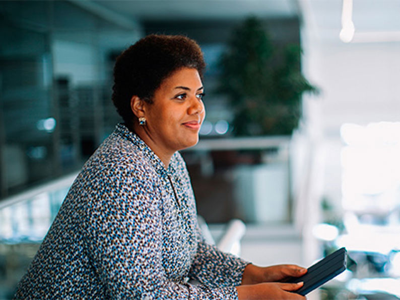 Businesswoman At Car Dealership