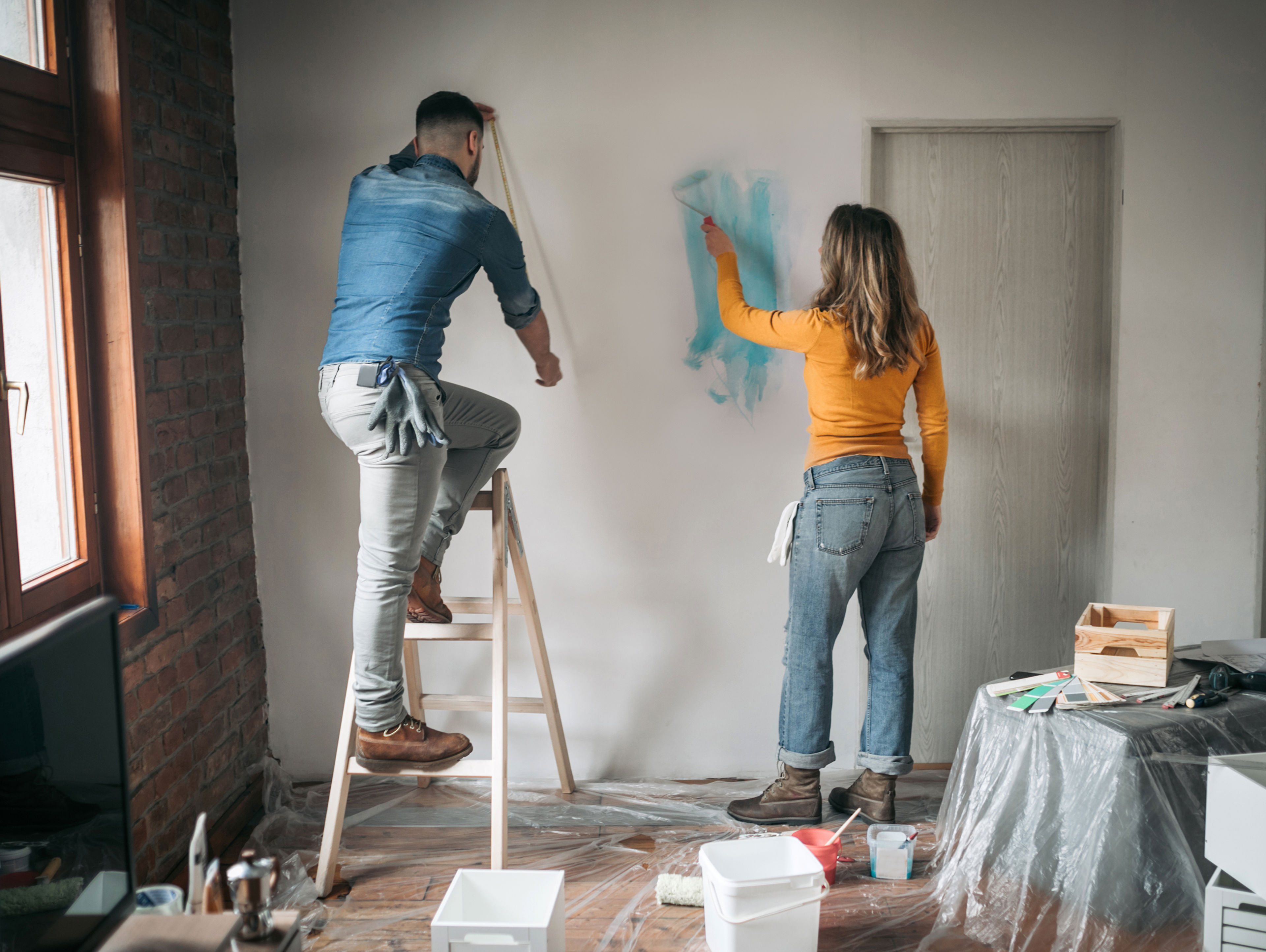 Couple Painting Apartment Together