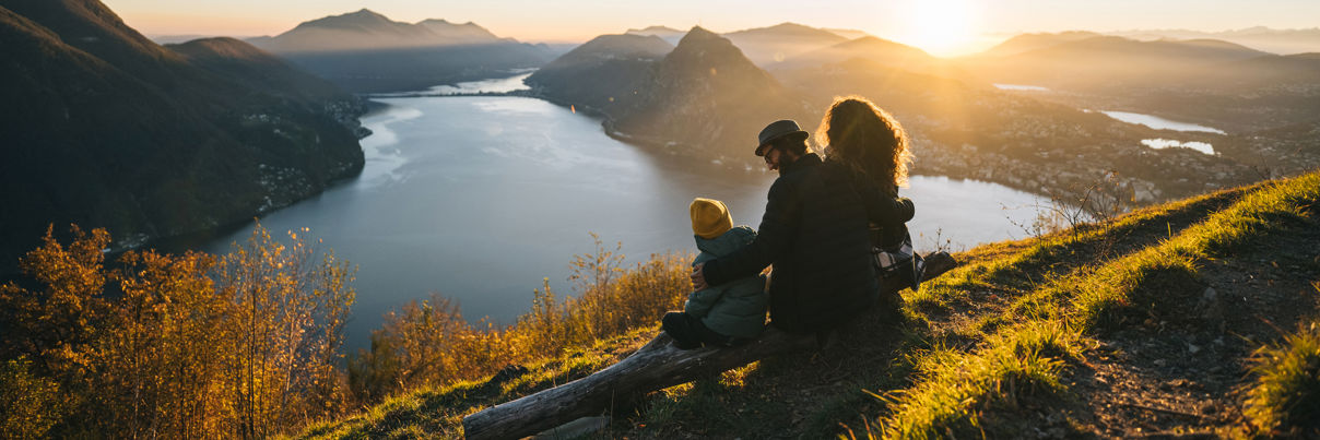 Family looking over water to mountains