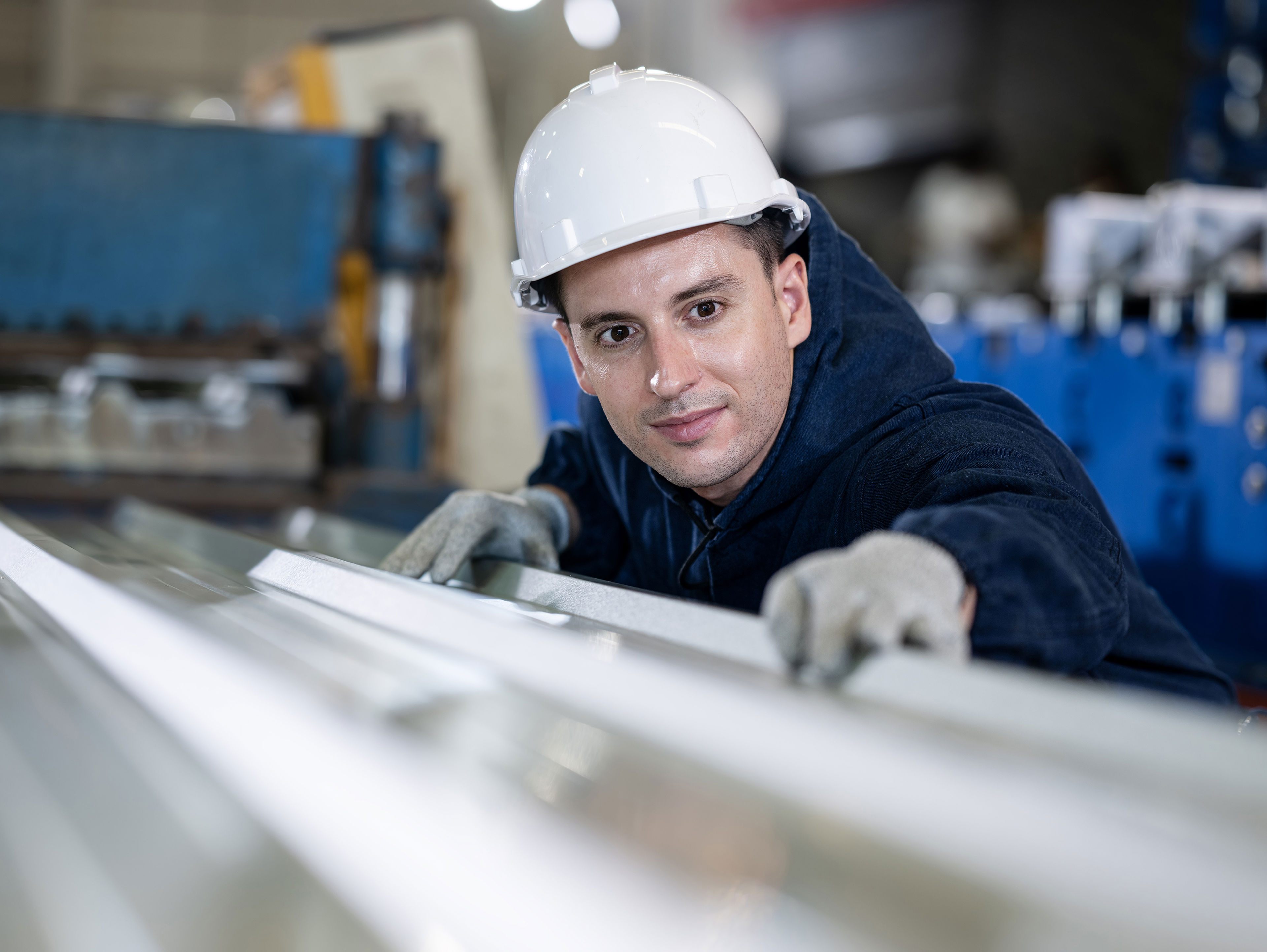 Quality Control Engineer Examines The Surface Of The Sheet