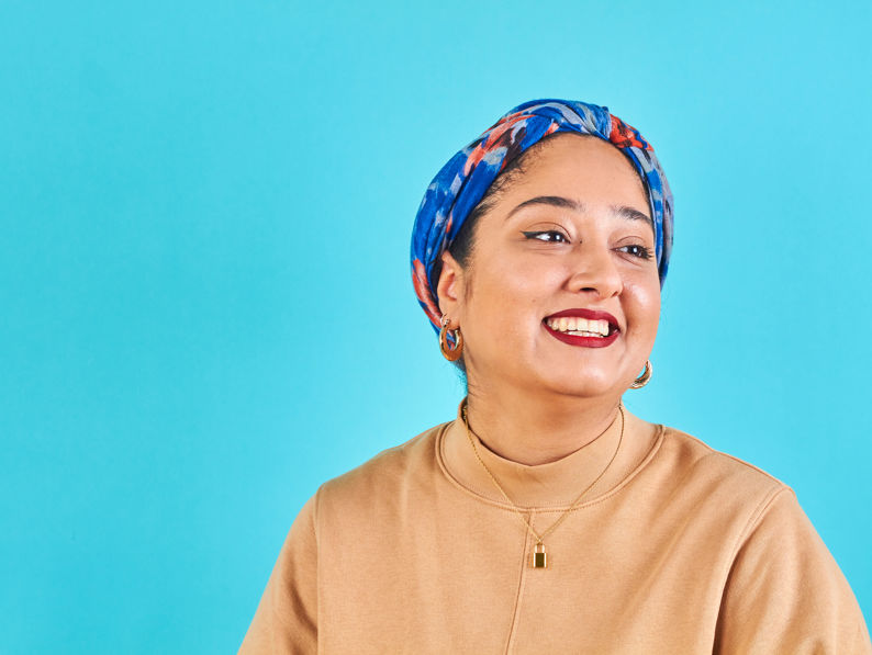 Woman Smiling And Looking Away