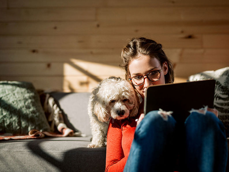 Woman With Dog And Tablet